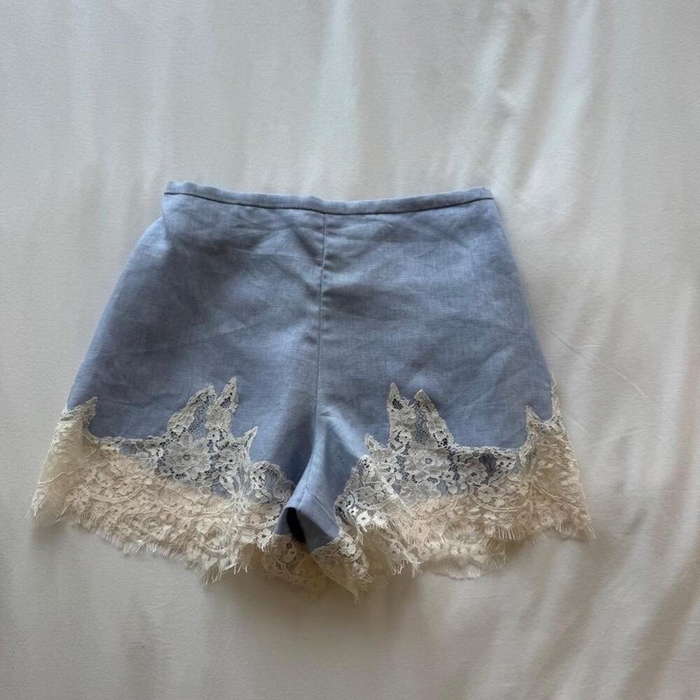 Reformation blue linen shorts with white lace trim